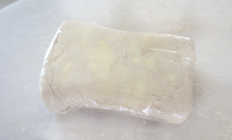 puff pastry folded and wrapped in plastic