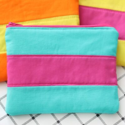 turquoise and pink striped costmetic bag