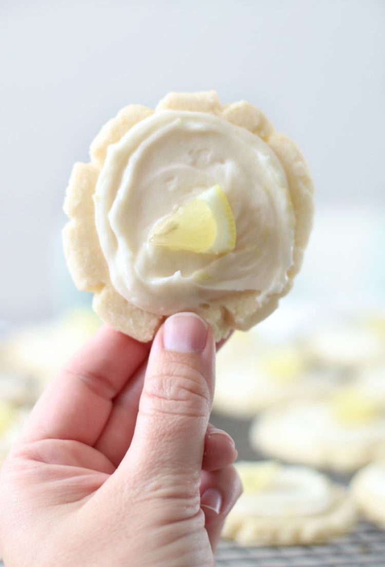 hand holding lemon sugar cookie