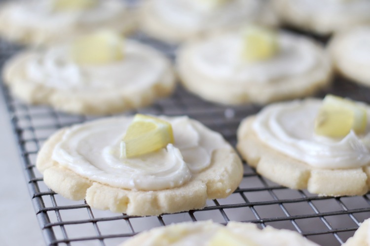 frosted cookies on cooling rack