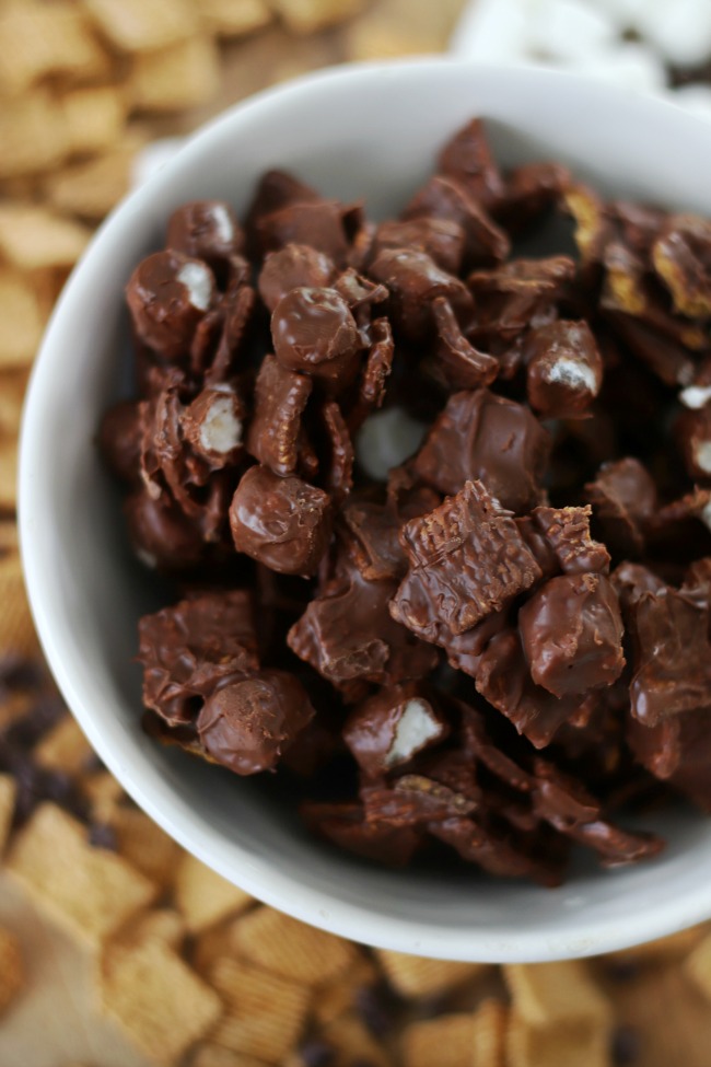 chocolate covered s'mores snack mix in white bowl