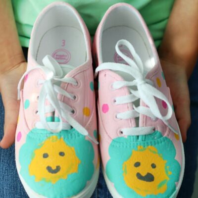 pair of pink painted shoes with flowers