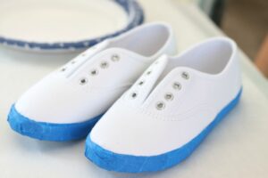 white canvas shoes wrapped with painter's tape