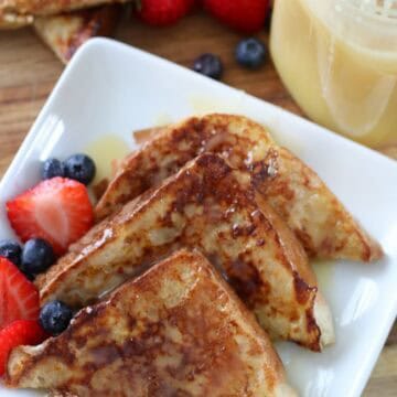 3 slices of French toast on plate drizzled in caramel syrup
