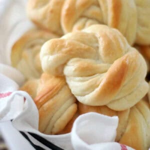 Basket of knotted dinner rolls.
