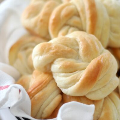 knotted dinner rolls in basket