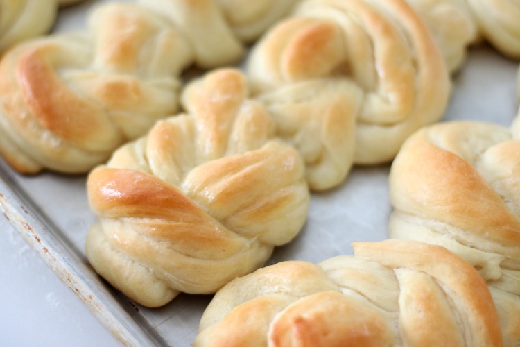 pan of buttery knotted rolls