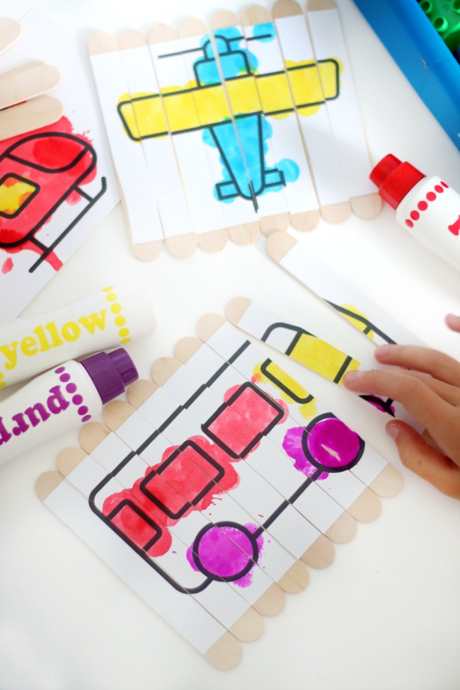 child putting puzzle sticks together