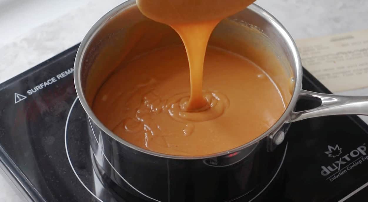 Saucepan of scotcheroo mixture melted and smooth.