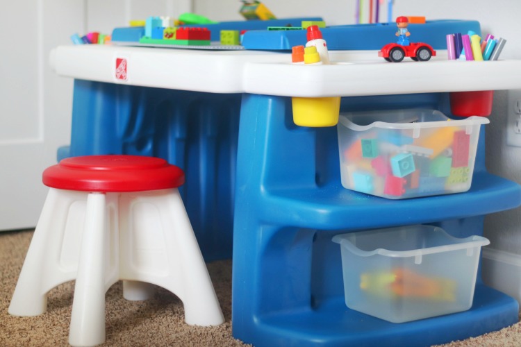 small preschool desk with legos in totes