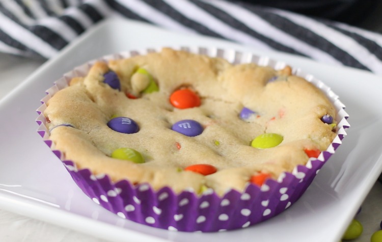 baked deep dish cookie in purple baking cup