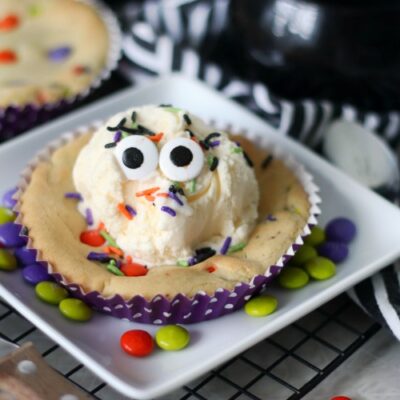 deep dish cookie with scoop of vanilla ice cream and candy eyes