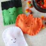 Frankenstein, pumpkin and ghost felt candy pouches.