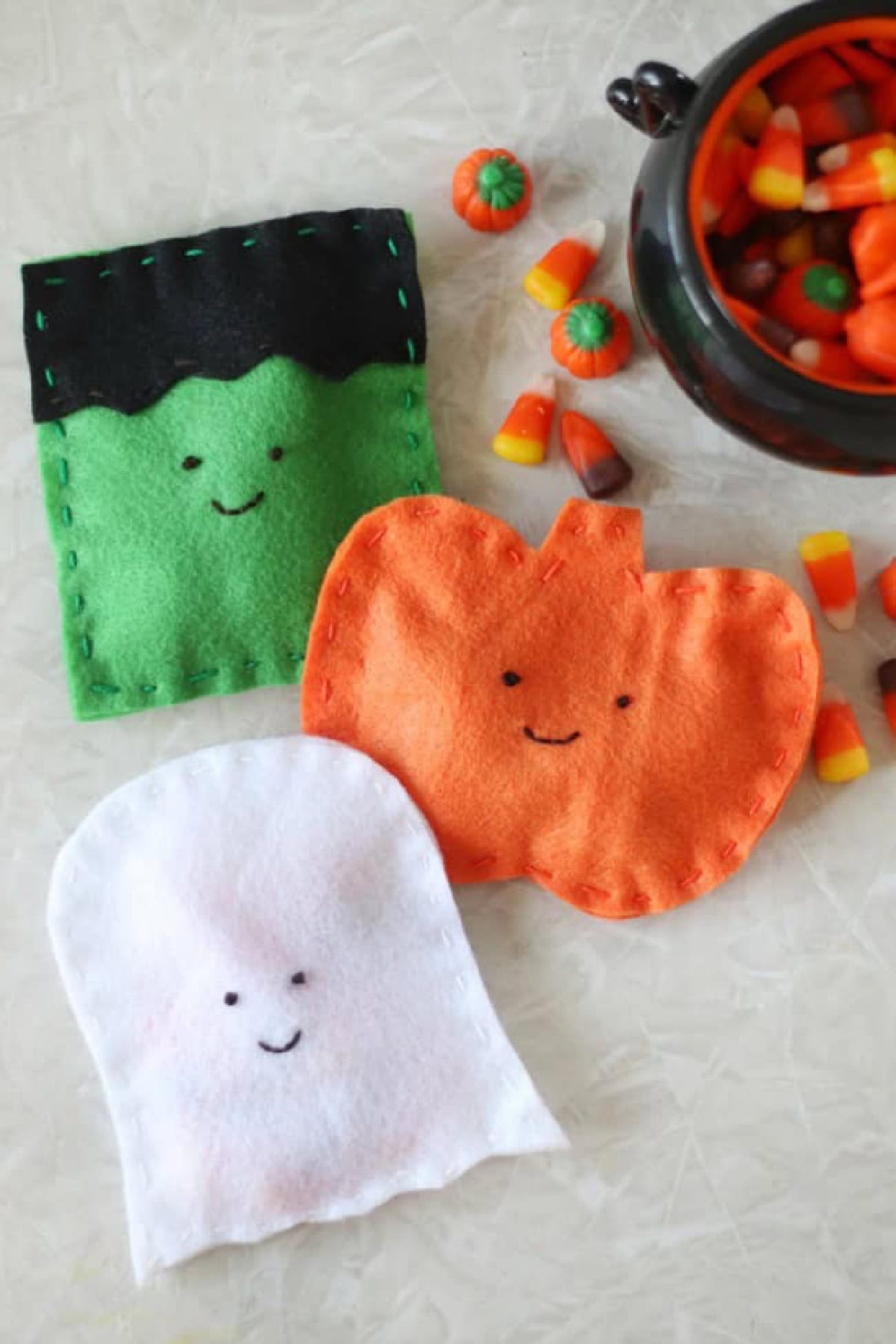 Frankenstein, pumpkin and ghost felt candy pouches.