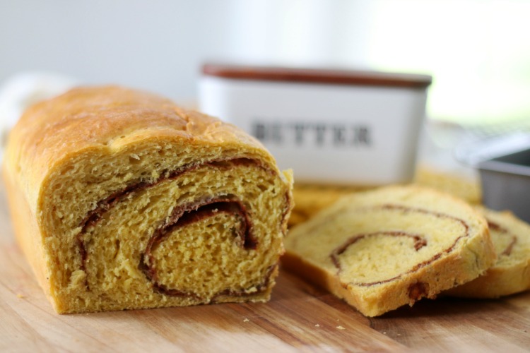 loaf of pumpkin cinnamon swirl bread sliced into