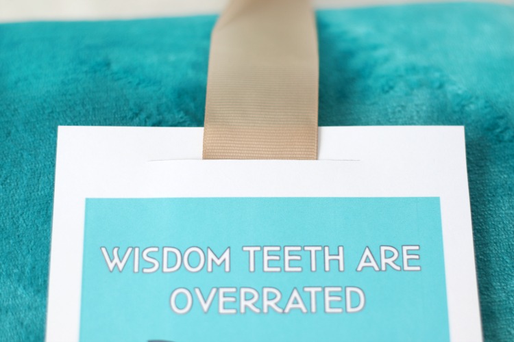 ribbon slid through slit of wisdom teeth card