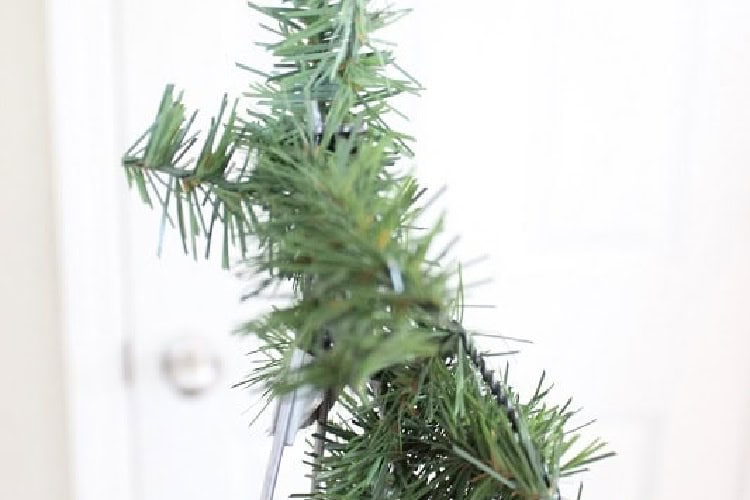 Garland tied to top of tomato cage.
