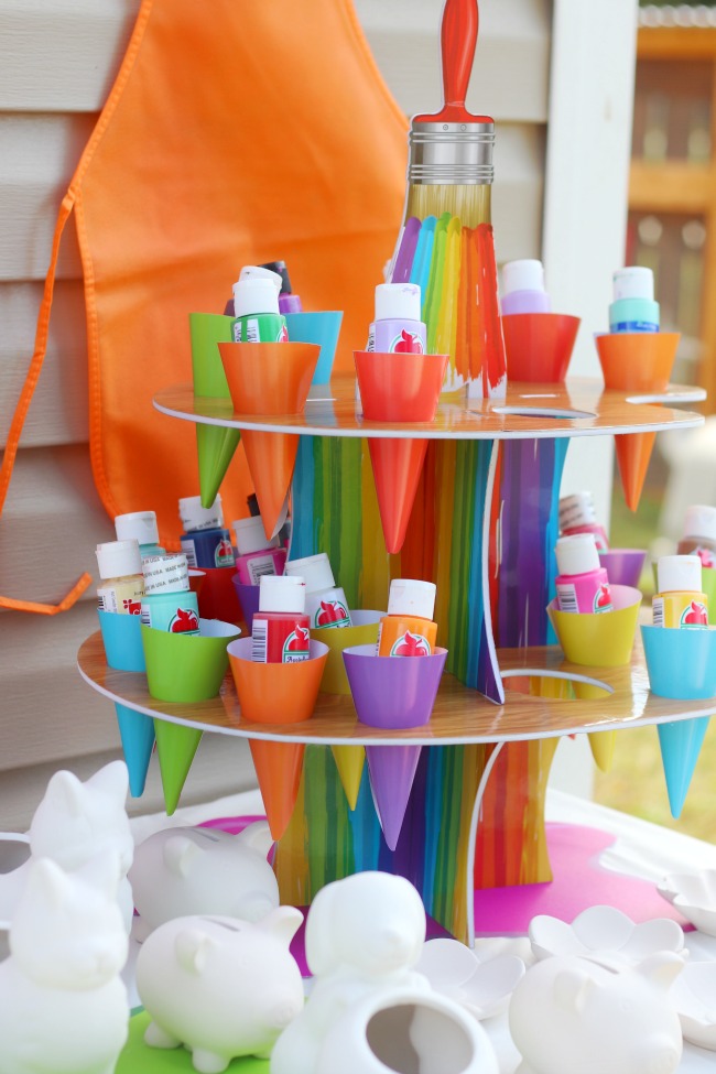 display with bottles of acrylic paint for pottery party