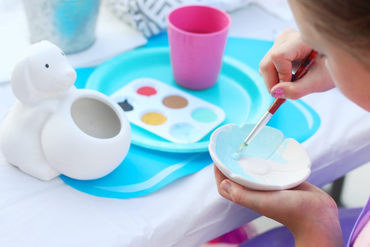 child painting ring dish at pottery party