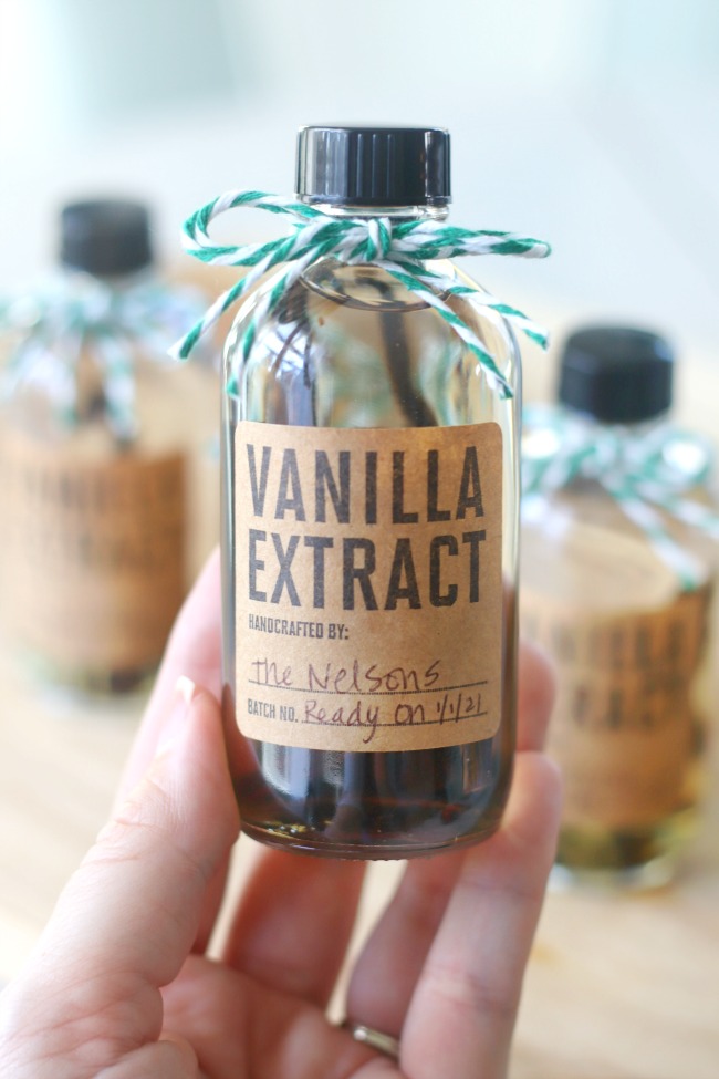 hand holding bottle of vanilla extract