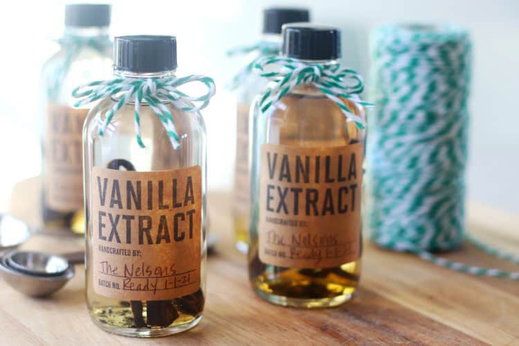 Bottles of vanilla extract with green bakers twine