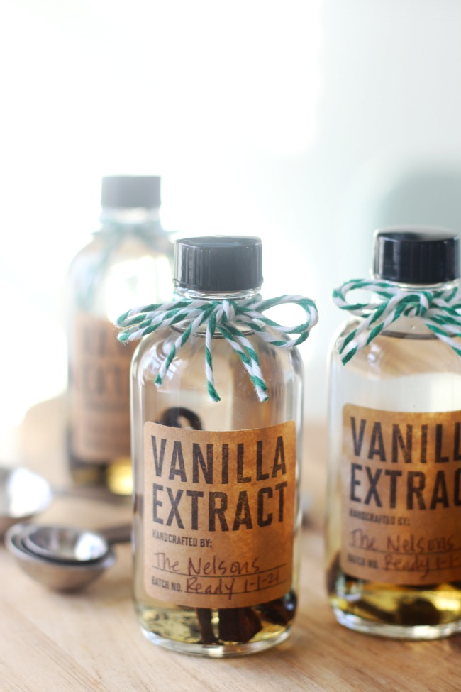 bottles of vanilla extract on cutting board