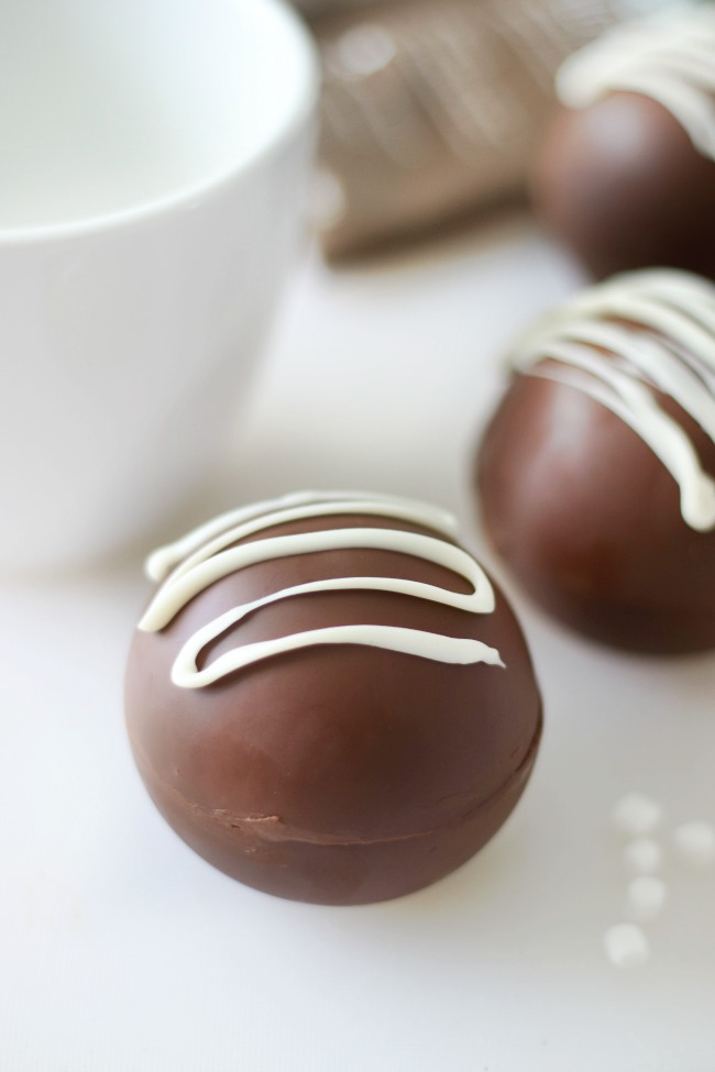 hot chocolate bomb drizzled in white chocolate