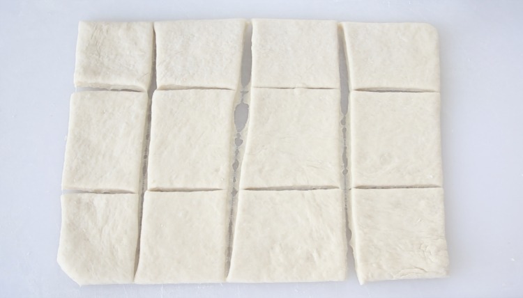dough sliced into squares for 1 hour rolls