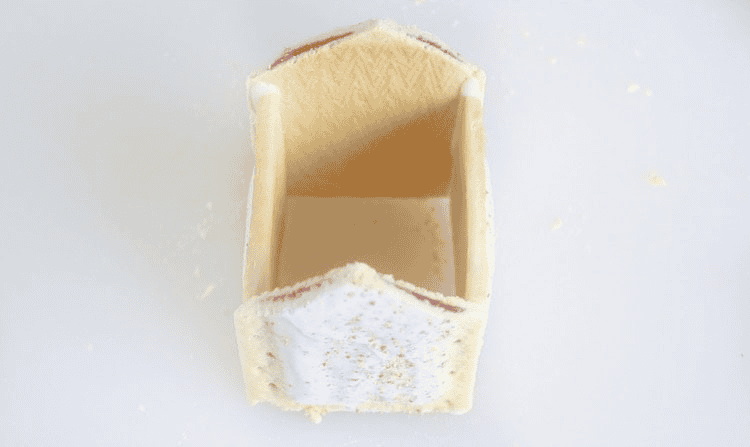 4 pop tarts glued together to form gingerbread house walls.
