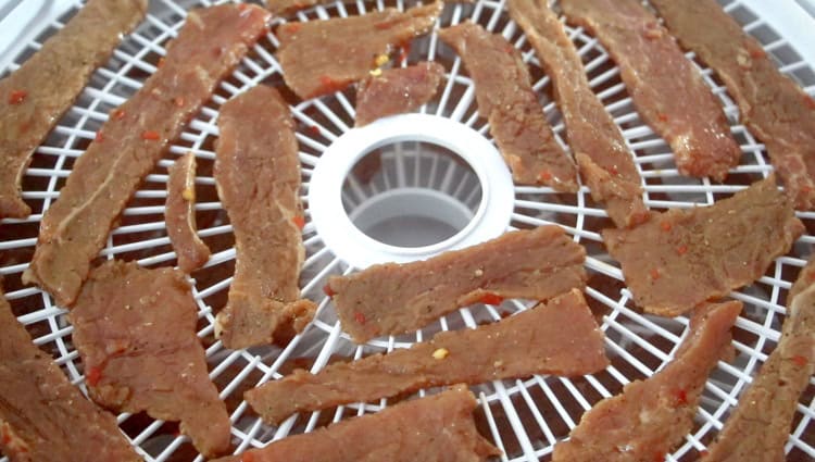 trays of jerky ready to go into dehydrator