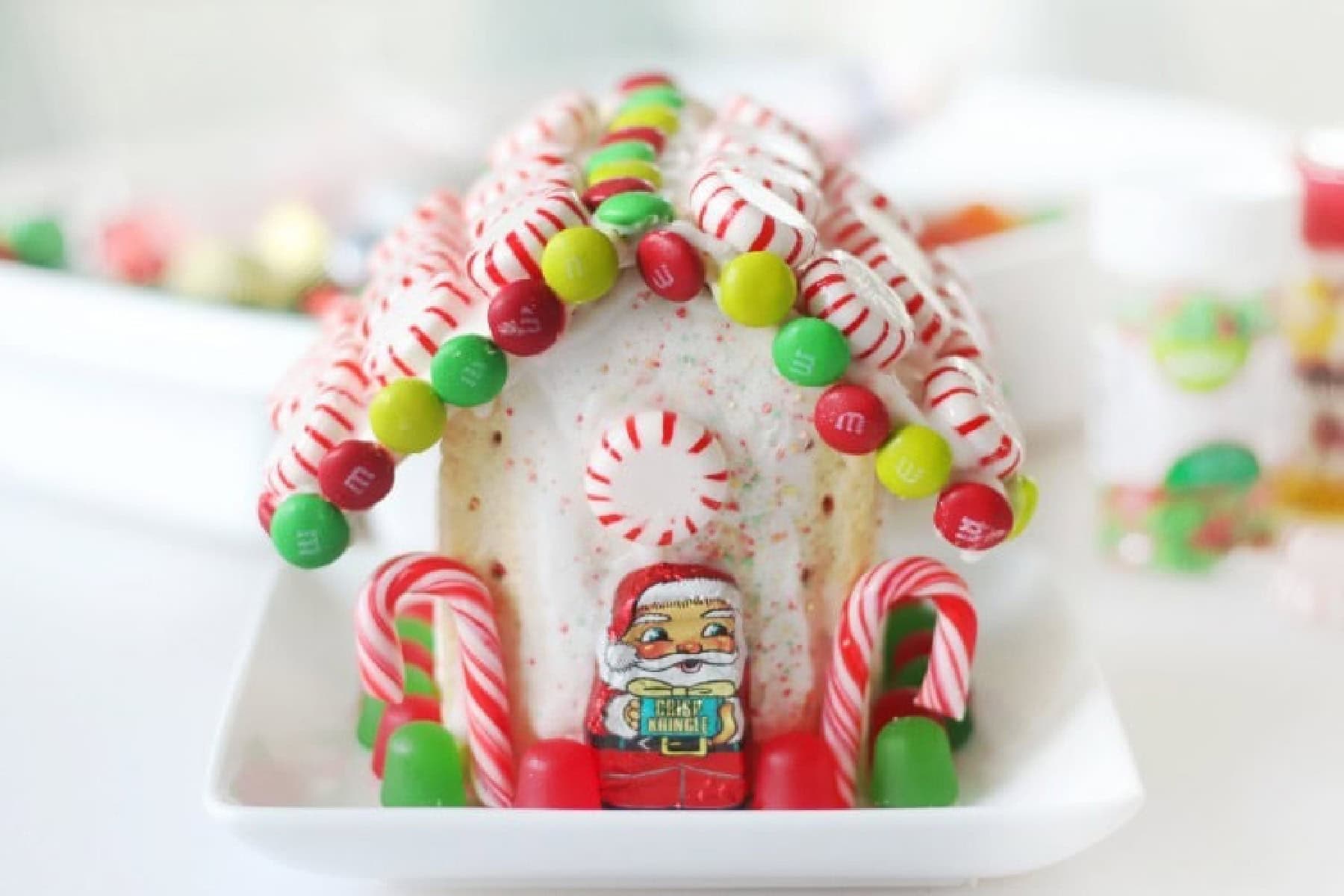 Pop tart gingerbread house decorated with candy and mints.