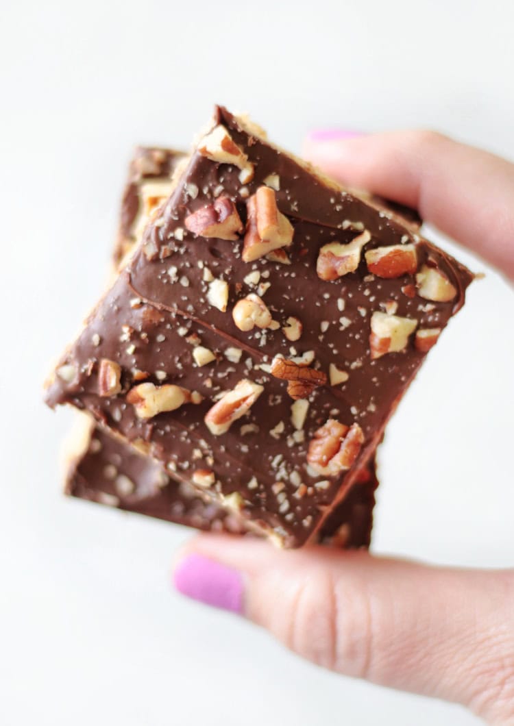 hand holding two classic toffee bars