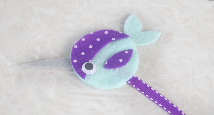 narwhal bookmark on table