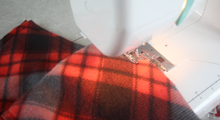 fleece being sewn by sewing machine
