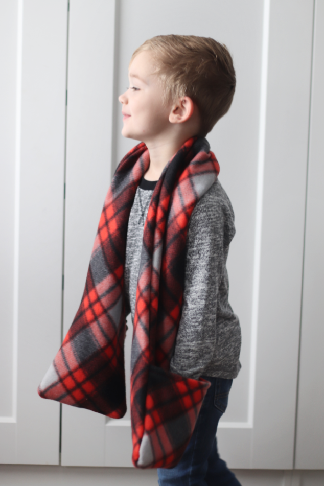 little boys with red and black pocket scarf around neck
