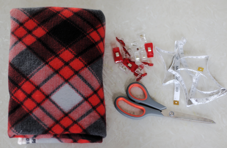 fleece fabric, scissors, sewing clips and measuring tape