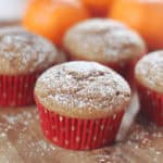 Gingerbread muffins in red muffin liners.