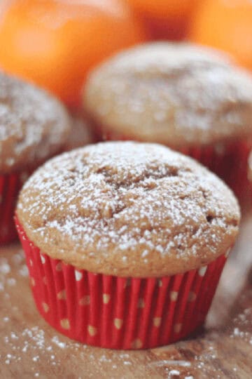 Gingerbread muffins in red muffin liners.