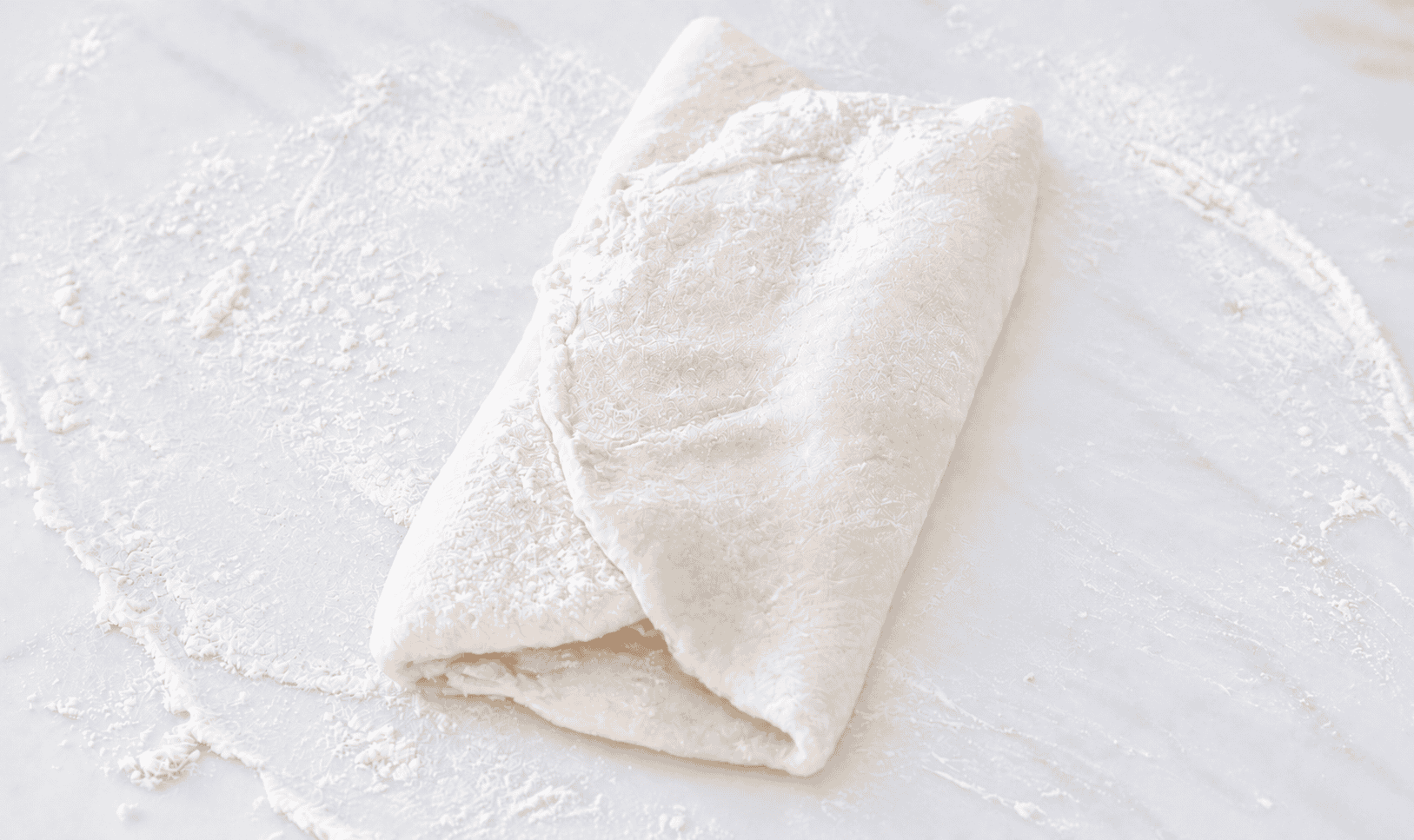 Croissant dough rolled and folded.