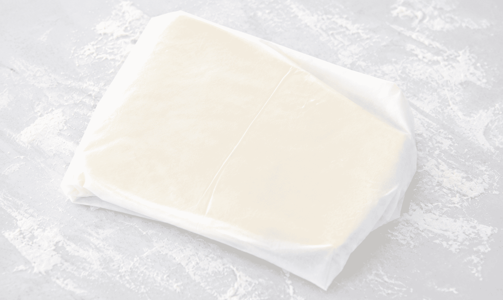 Butter wrapped in parchment paper.