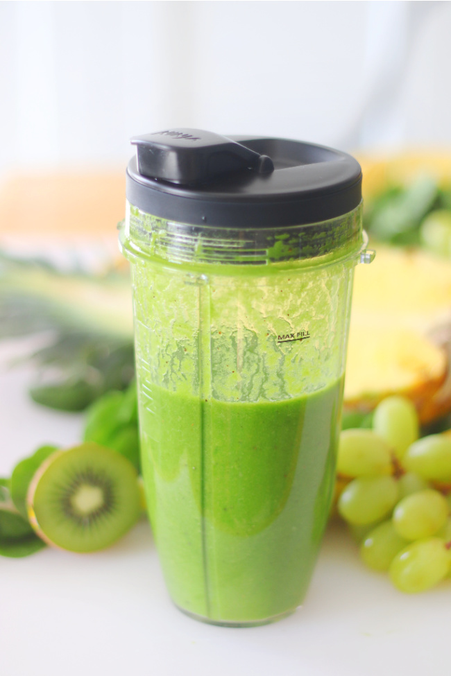 ninja blender cup with green smoothie