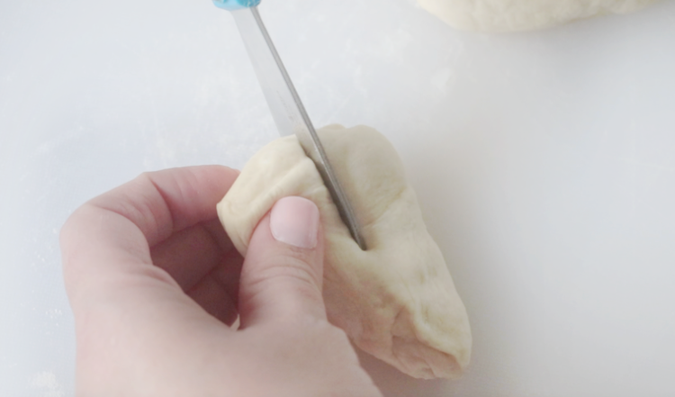 scissors cutting dough