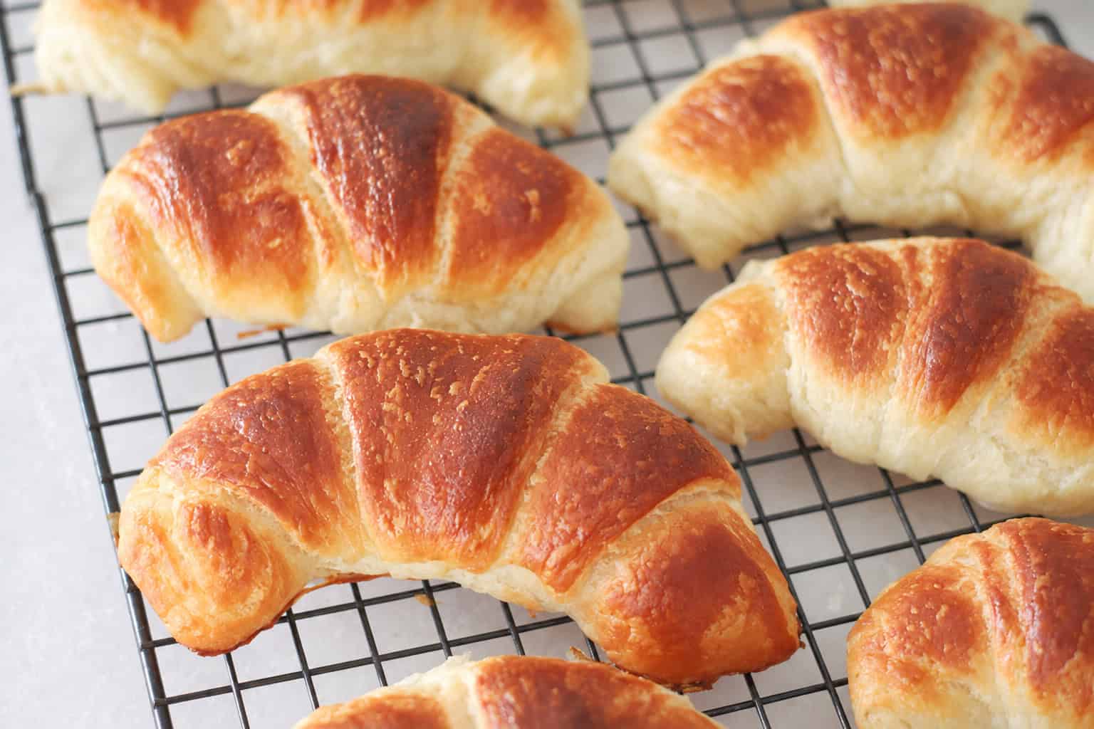 Croissants on cooling rack.