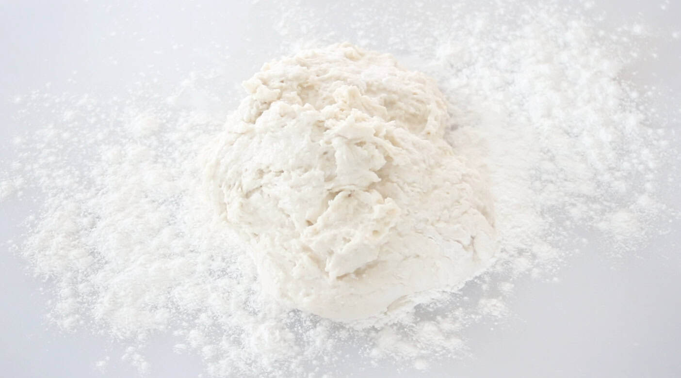 Dough on a floured surface.