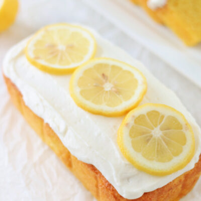 frosted lemon loaf cake with lemon slices