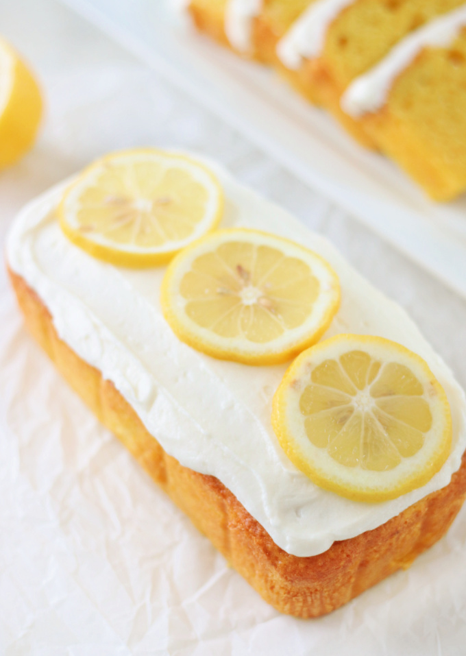 frosted lemon loaf cake with lemon slices
