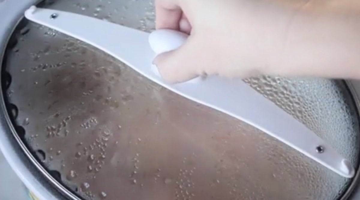 Lid on slow cooker of hot chocolate.