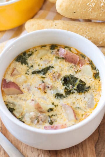 Bowl of soup and breadsticks.