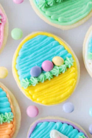 Oval sugar cookies decorated as an easter basket.
