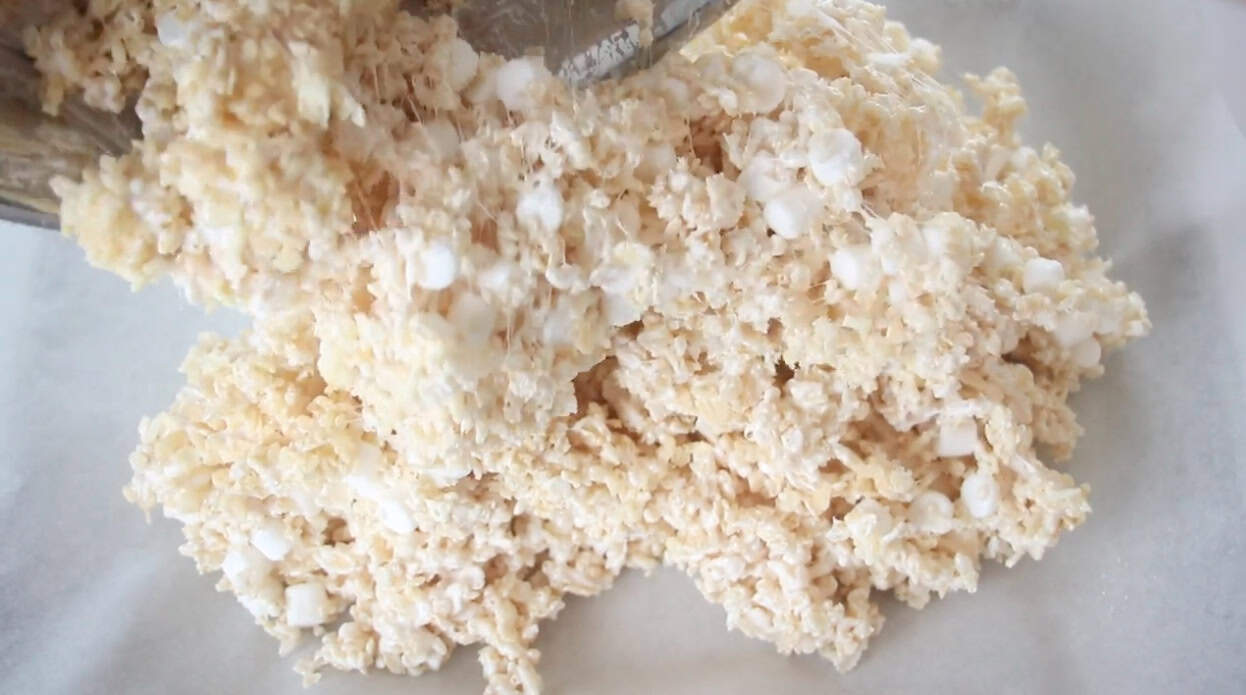 Rice krispies mixture poured into baking pan.